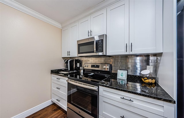 2706 11th Ct, Palm Harbor, FL 34684 - kitchen featuring appliances with stainless steel finishes, ornamental molding, baseboards, tasteful backsplash, and dark stone counters