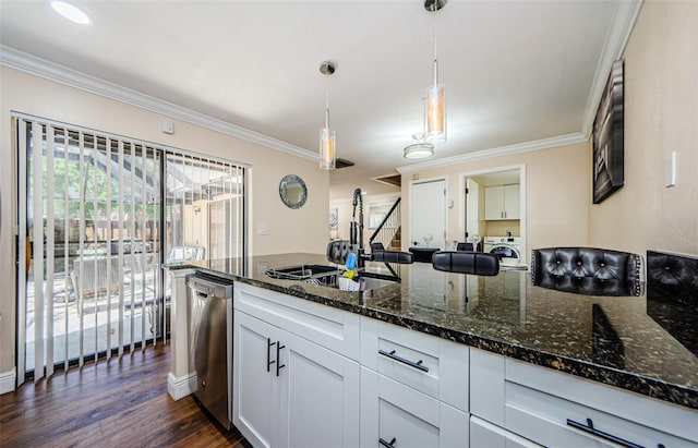 2706 11th Ct, Palm Harbor, FL 34684 - kitchen featuring dishwasher, a sink, crown molding, dark stone counters, and washer / dryer