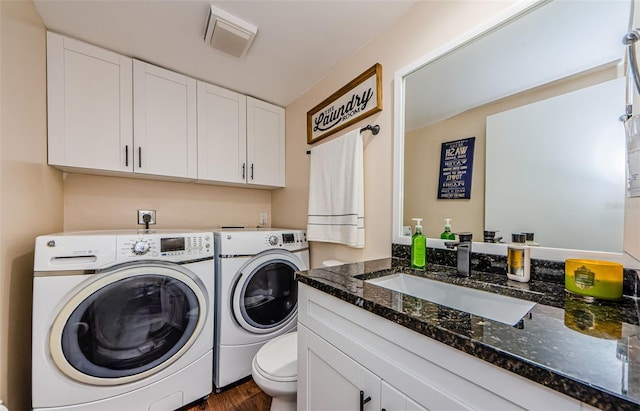 2706 11th Ct, Palm Harbor, FL 34684 - laundry area with washer and dryer and dark wood-style floors
