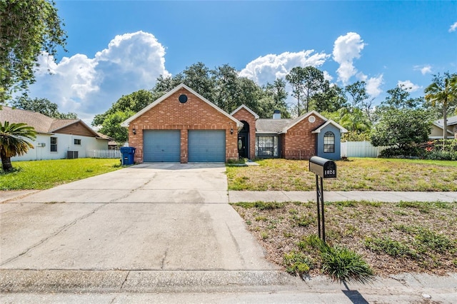 1024 Dockside Dr, Lutz, FL 33559 - view of front of home featuring brick siding, an attached garage, and concrete driveway