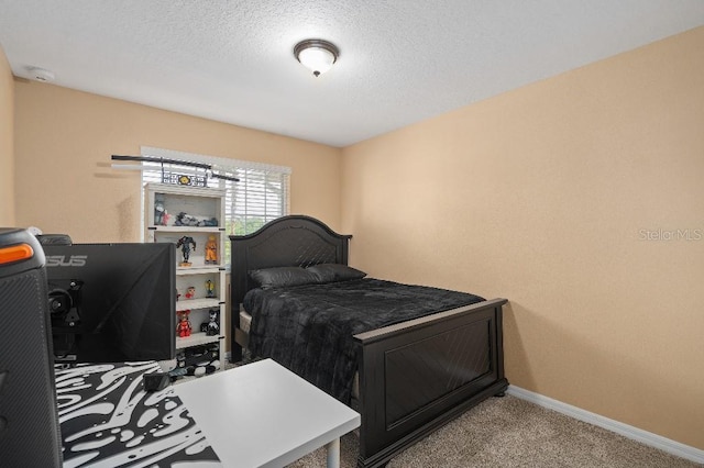 2417 Passamonte Dr Unit 1E, Winter Park, FL 32792 - bedroom featuring carpet, baseboards, and a textured ceiling