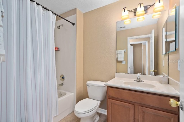 2417 Passamonte Dr Unit 1E, Winter Park, FL 32792 - bathroom with vanity, toilet, shower / tub combo with curtain, and a textured wall