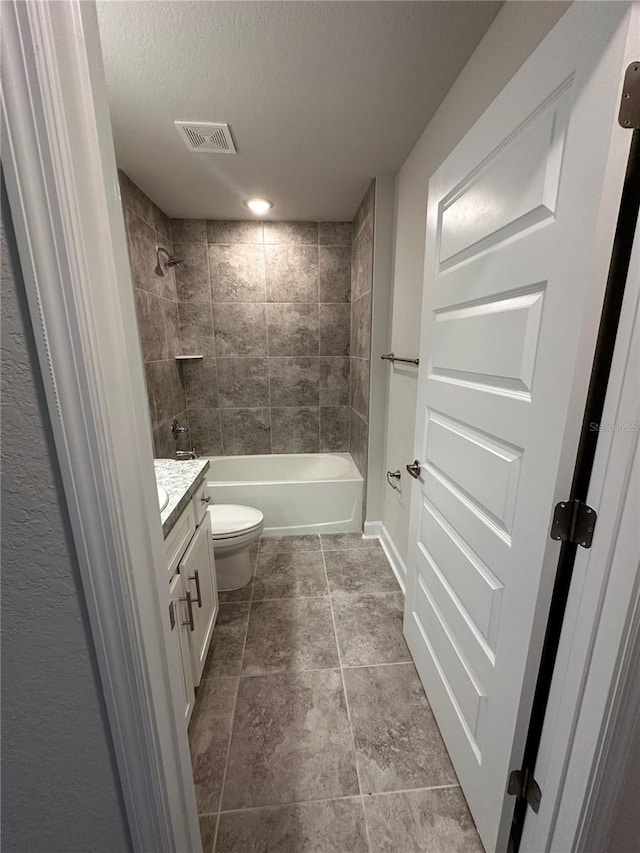 1259 Groveland Ln, Lakeland, FL 33811 - full bath featuring toilet, shower / bathtub combination, vanity, and a textured ceiling