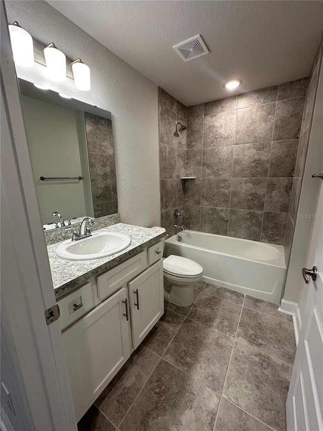 1259 Groveland Ln, Lakeland, FL 33811 - full bathroom featuring shower / bath combination, a textured wall, vanity, toilet, and a textured ceiling