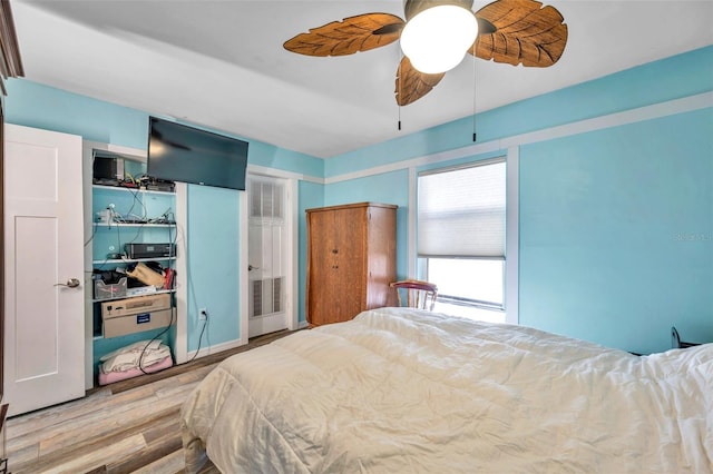 8931 Blind Pass Rd Unit 360, St Pete Beach, FL 33706 - bedroom featuring wood finished floors and a ceiling fan