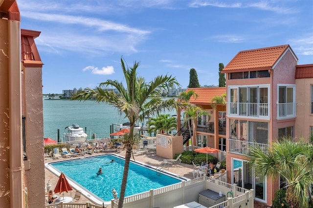 8931 Blind Pass Rd Unit 360, St Pete Beach, FL 33706 - community pool featuring a water view and a patio
