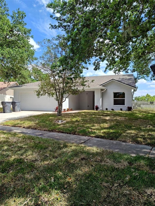 12910 Longcrest Dr, Riverview, FL 33579 - view of front facade with an attached garage, driveway, and stucco siding