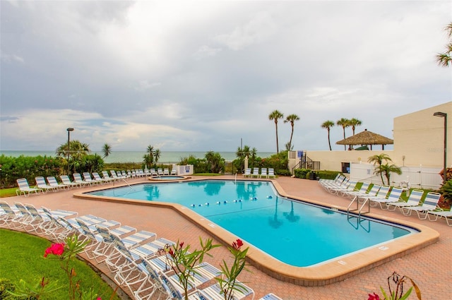 14950 Gulf Blvd Unit 603, Madeira Beach, FL 33708 - community pool featuring a patio area and a community hot tub
