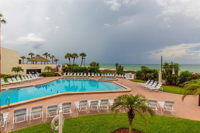 14950 Gulf Blvd Unit 603, Madeira Beach, FL 33708 - community pool with a patio, a water view, and a community hot tub