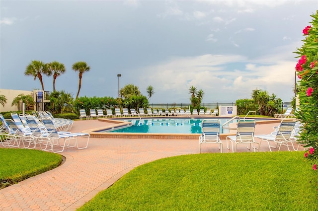 14950 Gulf Blvd Unit 603, Madeira Beach, FL 33708 - community pool with a patio and a yard