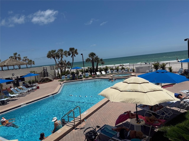 14950 Gulf Blvd Unit 603, Madeira Beach, FL 33708 - community pool with a hot tub, a patio, and a water view