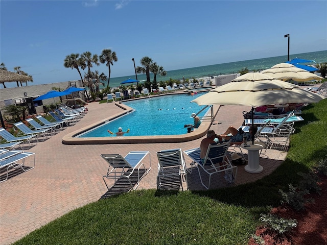 14950 Gulf Blvd Unit 603, Madeira Beach, FL 33708 - community pool featuring a water view and a patio