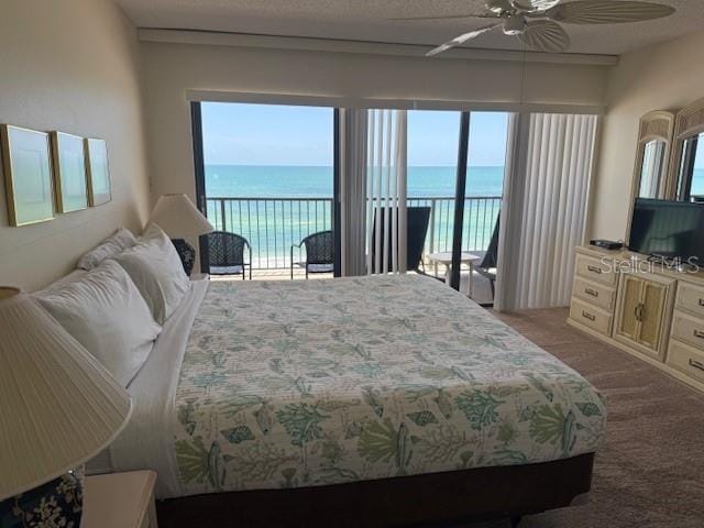 14950 Gulf Blvd Unit 603, Madeira Beach, FL 33708 - bedroom featuring access to outside, light colored carpet, multiple windows, and a ceiling fan