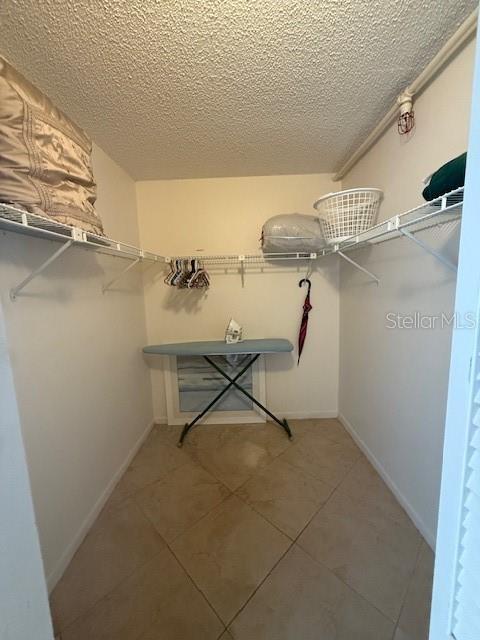 14950 Gulf Blvd Unit 603, Madeira Beach, FL 33708 - spacious closet with light tile patterned flooring