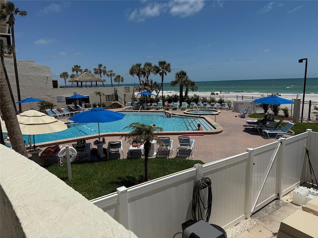 14950 Gulf Blvd Unit 603, Madeira Beach, FL 33708 - community pool with a community hot tub, a patio area, a fenced backyard, and a water view