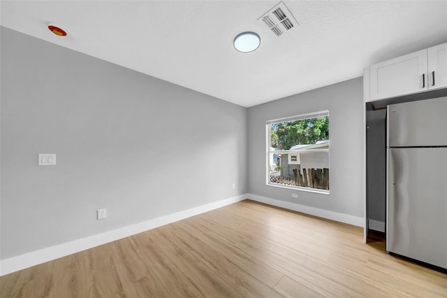 8504 N 17th St, Tampa, FL 33604 - empty room featuring light wood-type flooring and baseboards