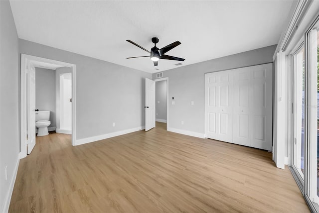 8504 N 17th St, Tampa, FL 33604 - unfurnished bedroom featuring baseboards, light wood-type flooring, a closet, and ceiling fan