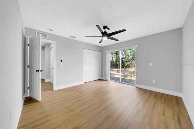 8504 N 17th St, Tampa, FL 33604 - unfurnished bedroom with light wood-style flooring, access to outside, baseboards, and a ceiling fan
