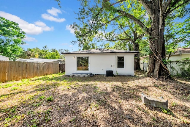 8504 N 17th St, Tampa, FL 33604 - back of house featuring a fenced backyard and central air condition unit