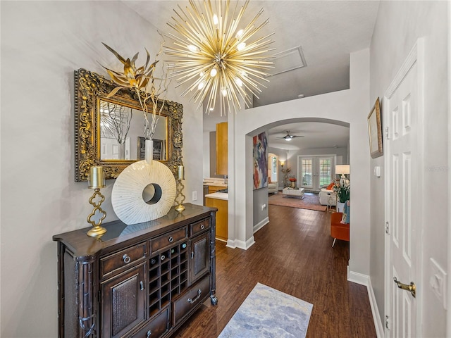 18003 Arbor Crest Dr, Tampa, FL 33647 - hall featuring arched walkways, dark wood-style flooring, and baseboards