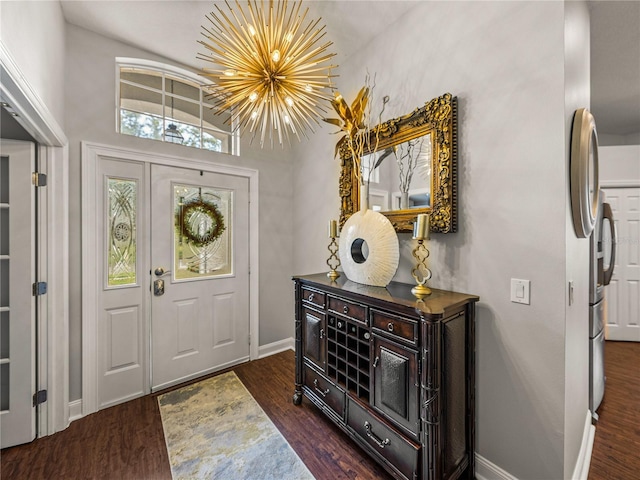 18003 Arbor Crest Dr, Tampa, FL 33647 - foyer with baseboards, dark wood-type flooring, and a chandelier