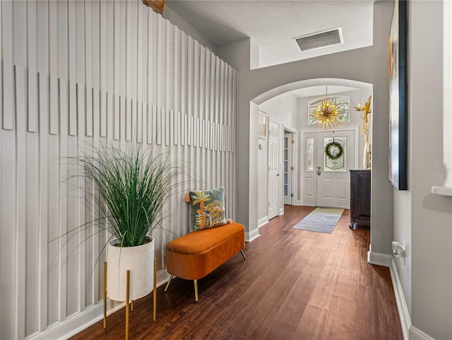 18003 Arbor Crest Dr, Tampa, FL 33647 - foyer entrance featuring arched walkways, wood finished floors, and baseboards