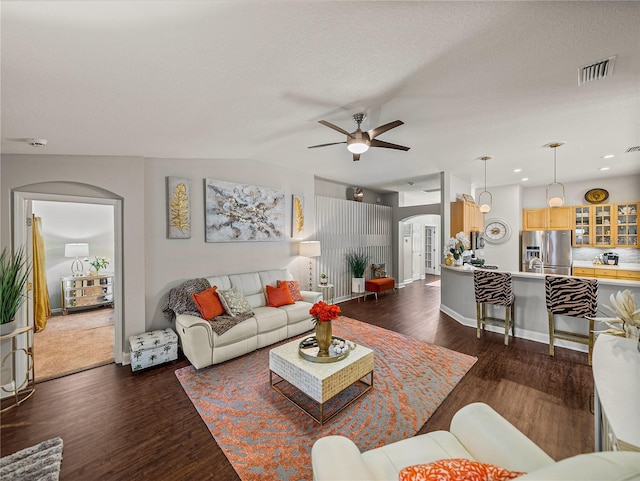 18003 Arbor Crest Dr, Tampa, FL 33647 - living room with arched walkways, ceiling fan, dark wood-type flooring, baseboards, and recessed lighting