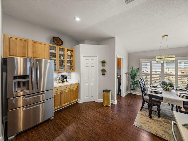 18003 Arbor Crest Dr, Tampa, FL 33647 - kitchen featuring stainless steel fridge with ice dispenser, lofted ceiling, dark wood-style flooring, baseboards, and glass insert cabinets