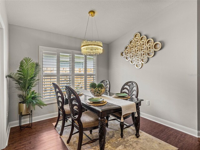 18003 Arbor Crest Dr, Tampa, FL 33647 - dining space featuring a chandelier, plenty of natural light, and baseboards