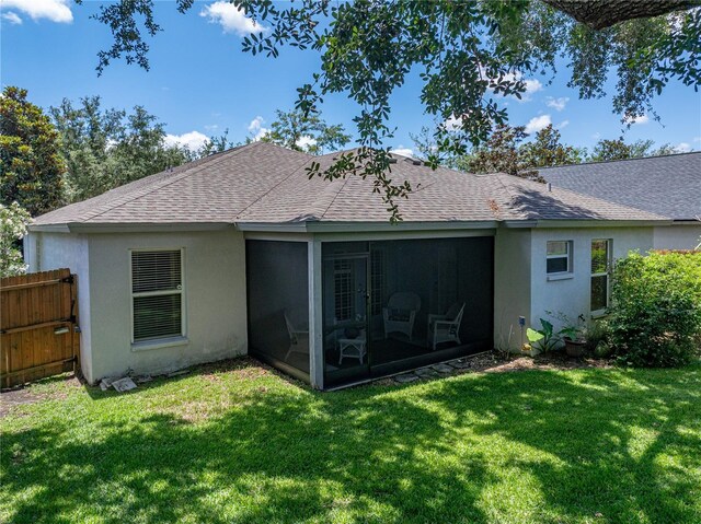 18003 Arbor Crest Dr, Tampa, FL 33647 - back of property featuring roof with shingles, a sunroom, and stucco siding