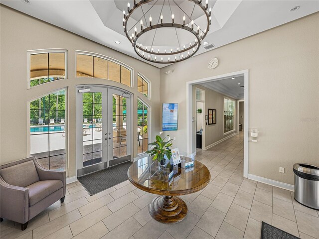 18003 Arbor Crest Dr, Tampa, FL 33647 - tiled entrance foyer with a chandelier, a high ceiling, recessed lighting, baseboards, and french doors