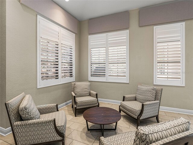 18003 Arbor Crest Dr, Tampa, FL 33647 - living area featuring light tile patterned floors and baseboards