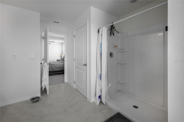 5189 Greenheart Ave, Mount Dora, FL 32757 - ensuite bathroom featuring baseboards, a shower stall, and tile patterned flooring