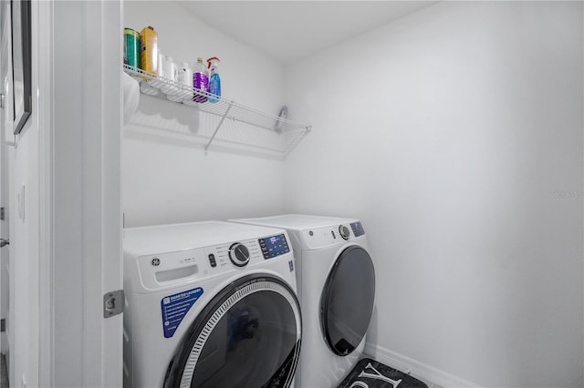 5189 Greenheart Ave, Mount Dora, FL 32757 - laundry area with independent washer and dryer and baseboards