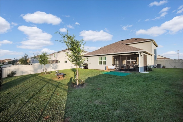 5189 Greenheart Ave, Mount Dora, FL 32757 - back of property with a sunroom, stucco siding, a gate, and cooling unit