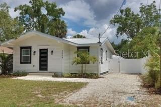 3008 E 38th Ave, Tampa, FL 33610 - view of front of property featuring gravel driveway