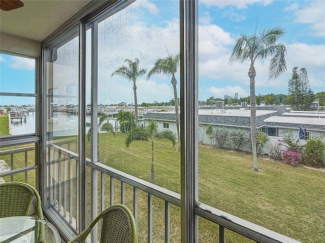 1 Boca Ciega Point Blvd Unit 215, Saint Petersburg, FL 33708 - unfurnished sunroom featuring a water view