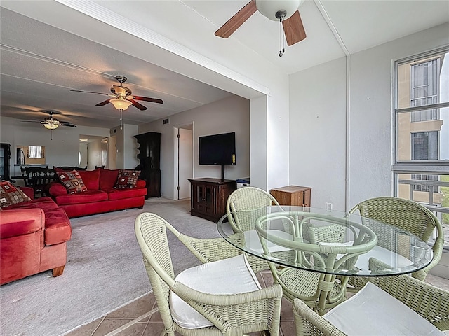 1 Boca Ciega Point Blvd Unit 215, Saint Petersburg, FL 33708 - carpeted dining room featuring ceiling fan and tile patterned floors