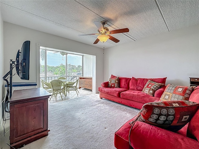 1 Boca Ciega Point Blvd Unit 215, Saint Petersburg, FL 33708 - living area featuring light carpet, a ceiling fan, and a textured ceiling