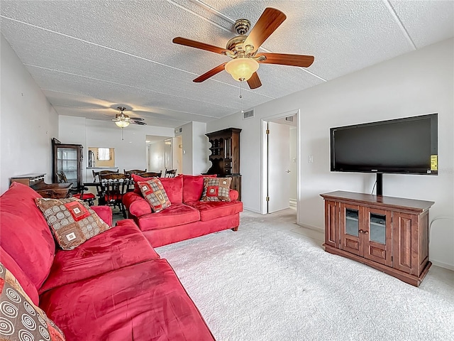 1 Boca Ciega Point Blvd Unit 215, Saint Petersburg, FL 33708 - carpeted living area featuring ceiling fan and a textured ceiling