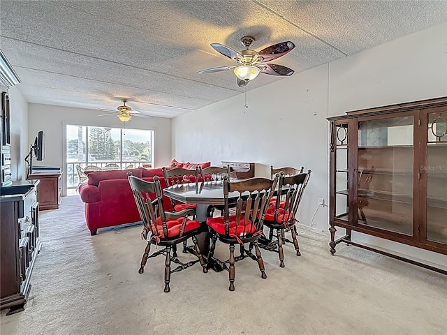 1 Boca Ciega Point Blvd Unit 215, Saint Petersburg, FL 33708 - dining area featuring a ceiling fan, light carpet, and a textured ceiling
