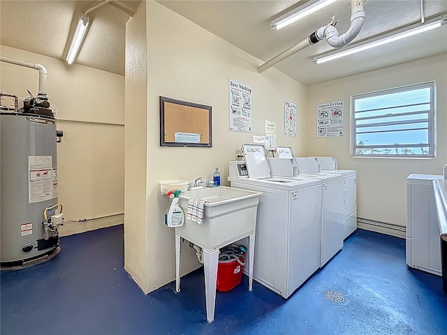 1 Boca Ciega Point Blvd Unit 215, Saint Petersburg, FL 33708 - communal laundry room with water heater and separate washer and dryer