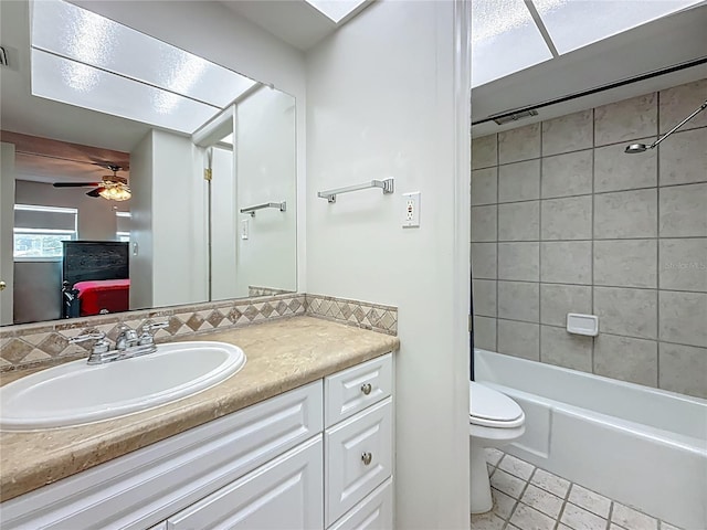 1 Boca Ciega Point Blvd Unit 215, Saint Petersburg, FL 33708 - bathroom featuring vanity, toilet,  shower combination, and ceiling fan