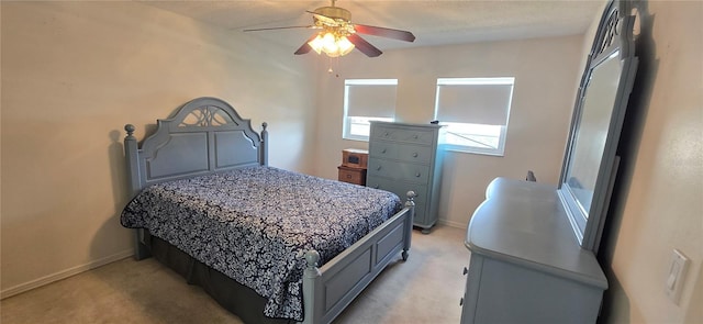 1 Boca Ciega Point Blvd Unit 215, Saint Petersburg, FL 33708 - bedroom featuring light colored carpet, baseboards, and a ceiling fan