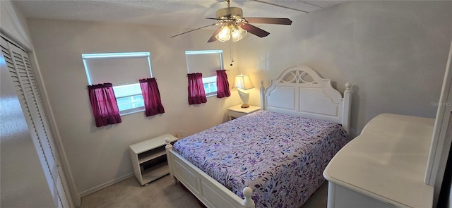 1 Boca Ciega Point Blvd Unit 215, Saint Petersburg, FL 33708 - bedroom with light colored carpet, a ceiling fan, and baseboards
