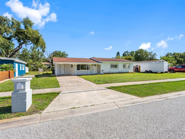 302 Patty Dr, Oldsmar, FL 34677 - single story home featuring concrete driveway and an attached carport