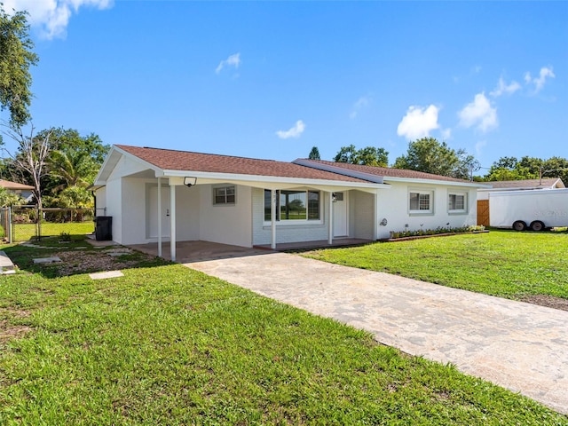 302 Patty Dr, Oldsmar, FL 34677 - ranch-style home featuring concrete driveway, an attached carport, and stucco siding