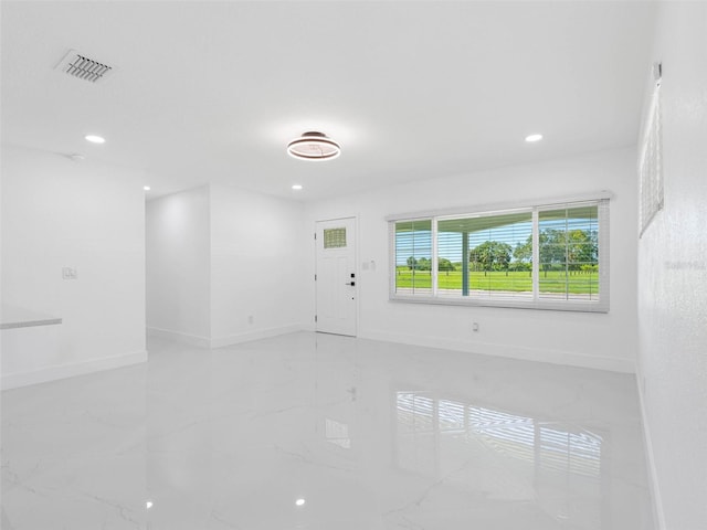 302 Patty Dr, Oldsmar, FL 34677 - unfurnished room with light marble finish flooring and recessed lighting
