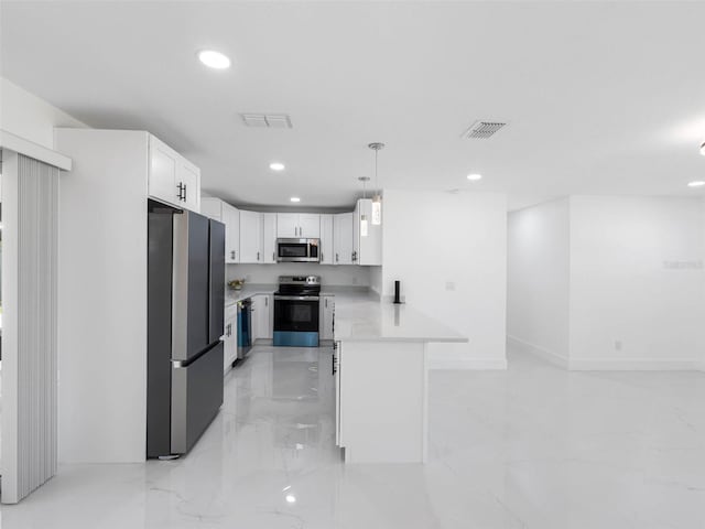 302 Patty Dr, Oldsmar, FL 34677 - kitchen with appliances with stainless steel finishes, recessed lighting, a peninsula, light countertops, and light marble finish flooring