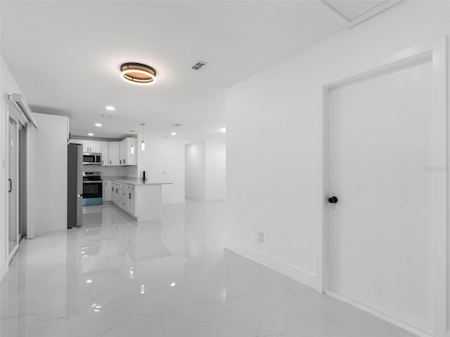 302 Patty Dr, Oldsmar, FL 34677 - hallway featuring light marble finish flooring and recessed lighting